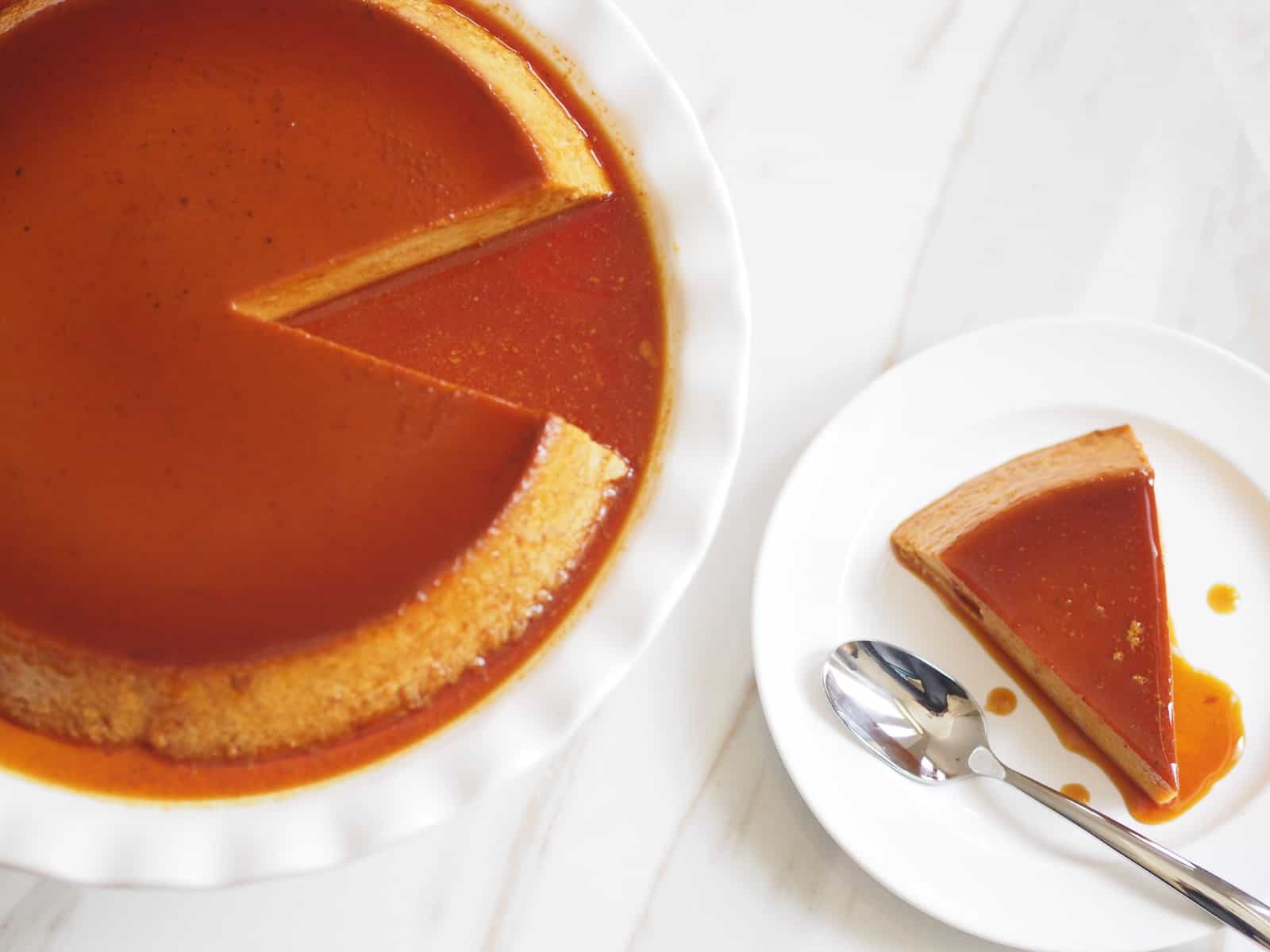 flan de calabaza plated with a slice served on the side